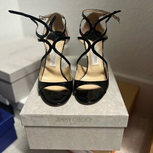 Jimmy Choo Azia Black Patent Ankle Strap Sandals.